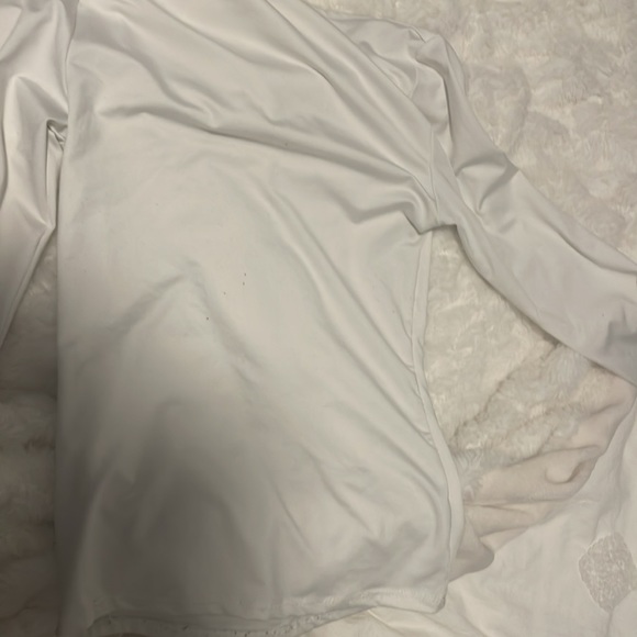 This is a great top the material is silky is a nice white almost never worn! - Picture 4 of 4